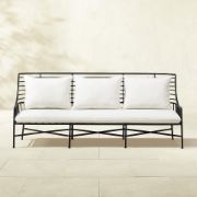 Streamlined Black Steel Outdoor Sofa with Plush Natural Cushions