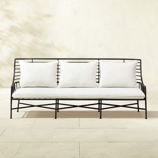 Streamlined Black Steel Outdoor Sofa with Plush Natural Cushions